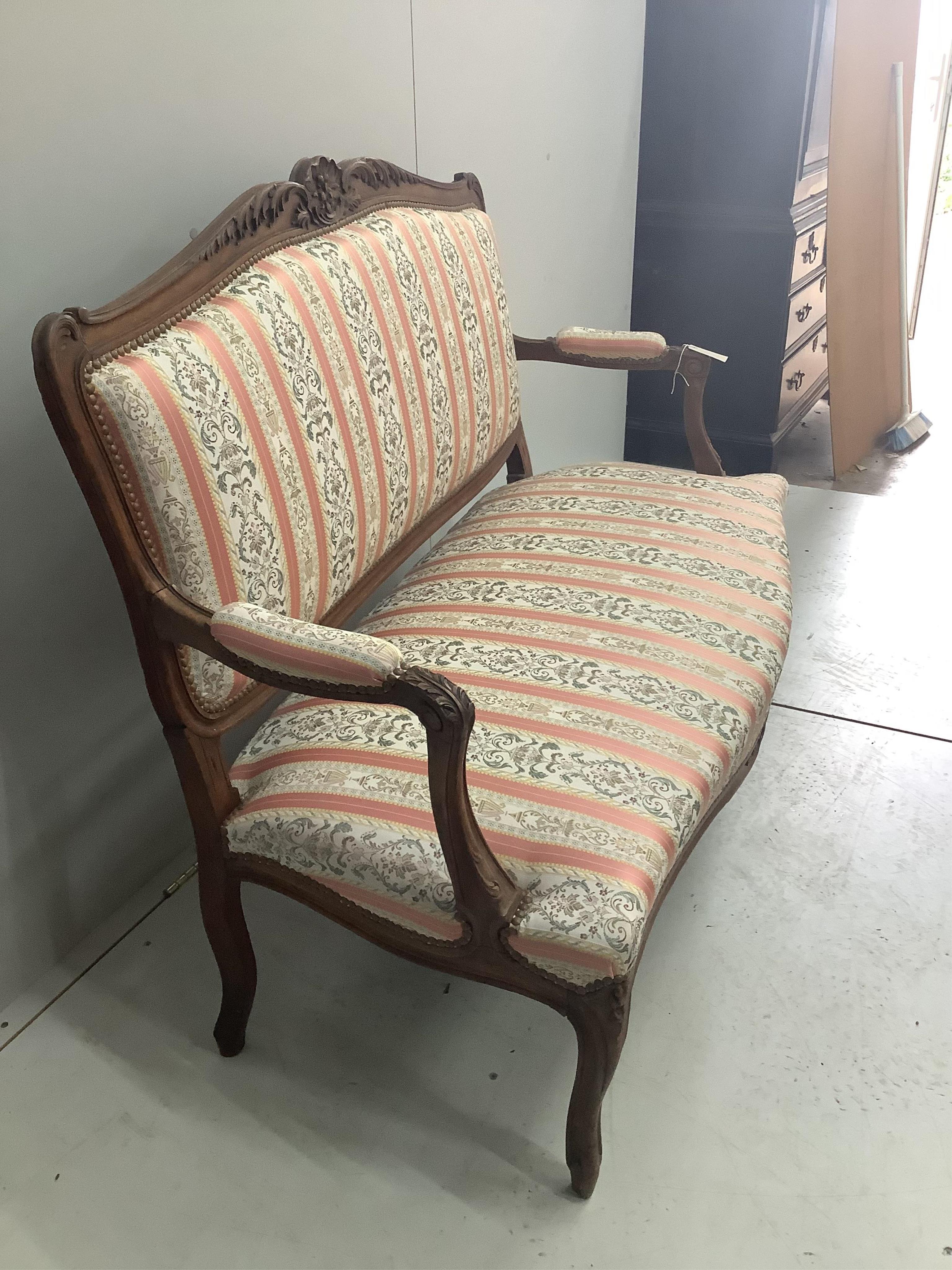 An early 20th century French beech upholstered sofa, width 130cm, depth 53cm, height 96cm. Condition - good